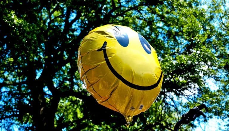 smiley face balloon (well-being concept)