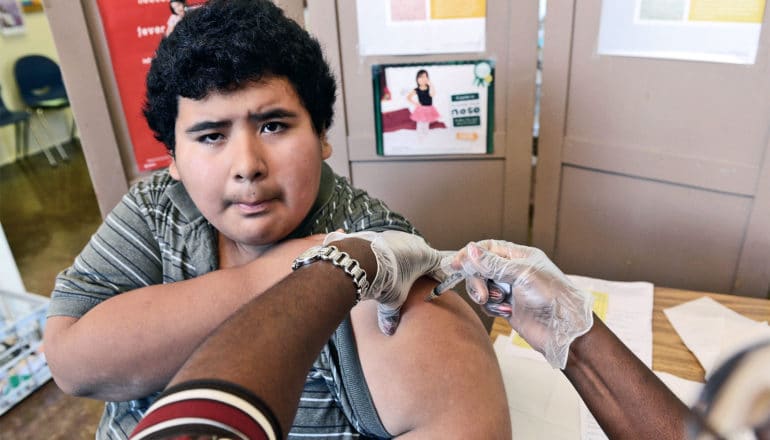 student getting vaccine