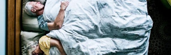 two older adults sleeping