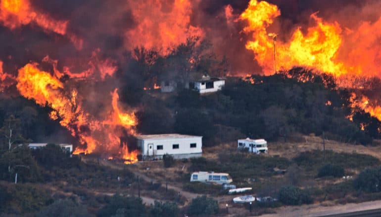 Flames sweep through a rural community at the Blue Cut Fire on August 17, 2016 near Wrightwood, California.