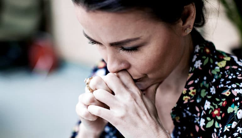 concerned woman thinking (sexual harassment concept)