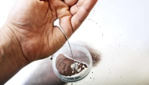 liquid metal pouring from hand