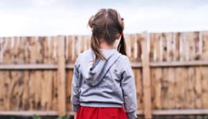 little girl in yard