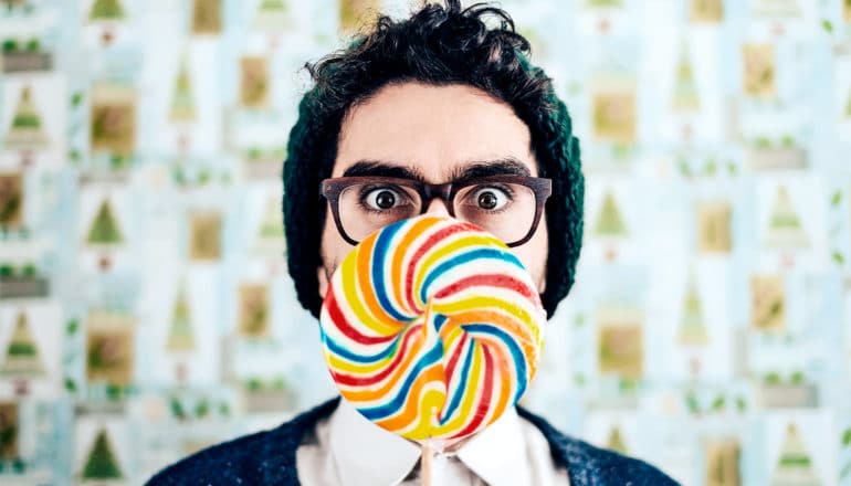 man with giant lollipop (taste concept)
