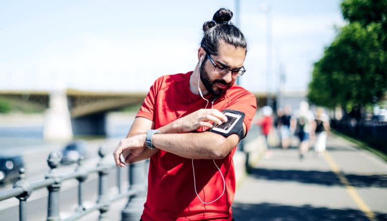 man working out with phone timer