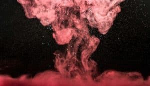 red plume under water on black