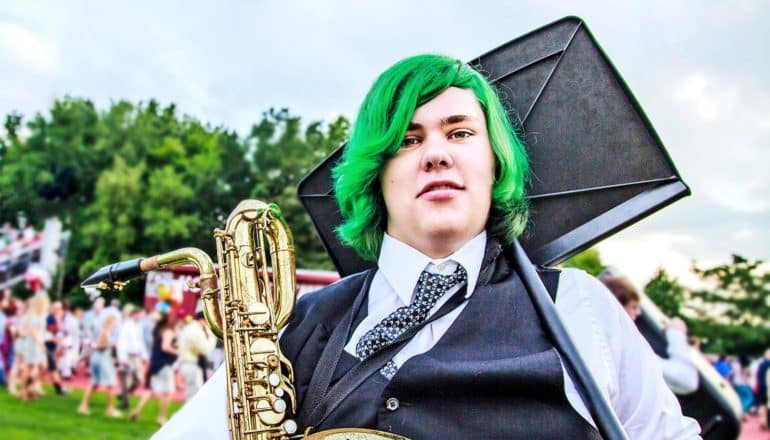 teen in band with green hair (puberty concept)