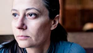 woman worried thinking (triple-negative breast cancer concept)