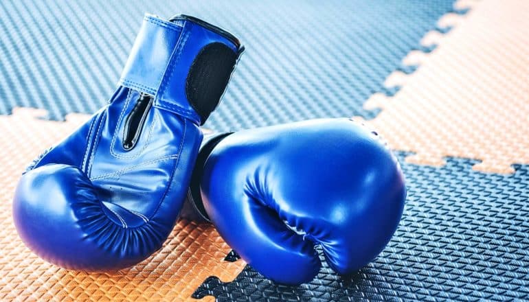 boxing gloves on gym floor