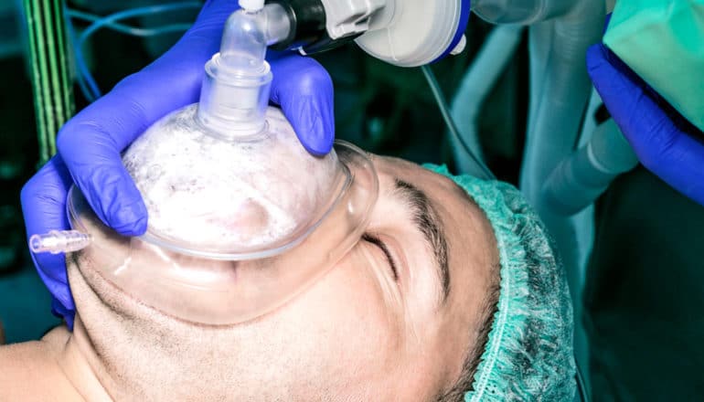 man under general anesthesia - mask on face