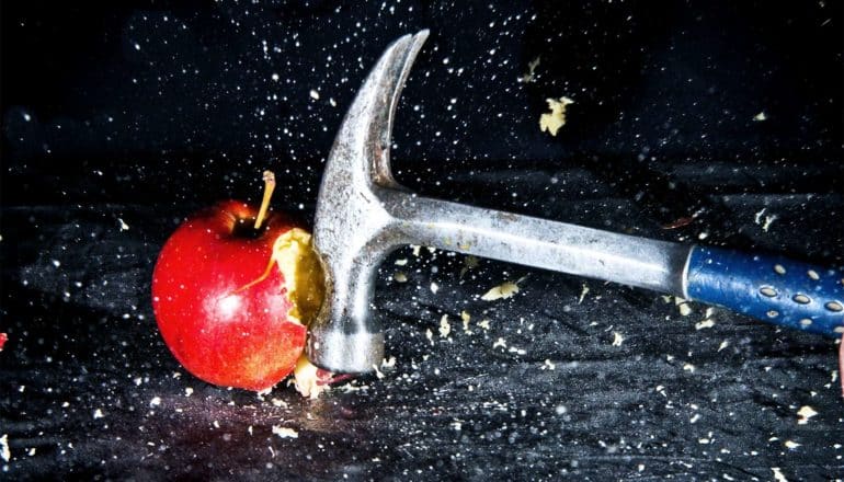 hammer smashing apple