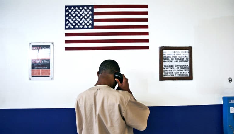 man on phone in prison (risk assessment concept)