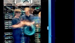 blurry coworkers in server room