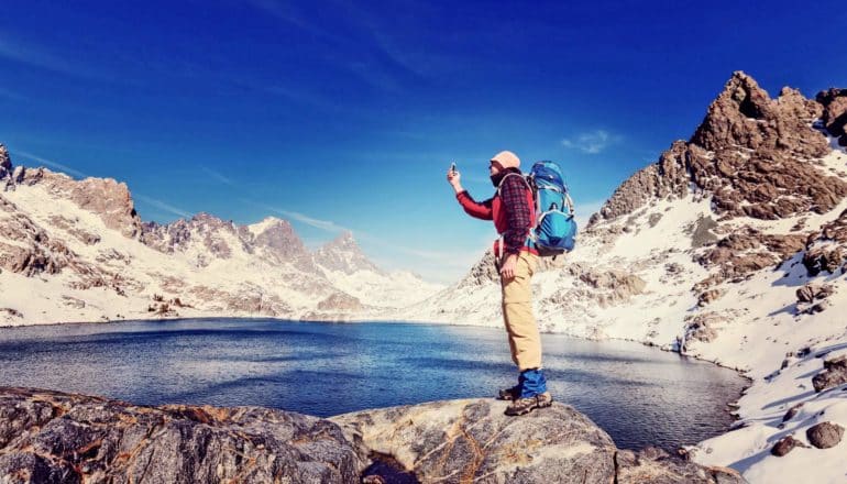 hiker next to Sierra Nevada pond