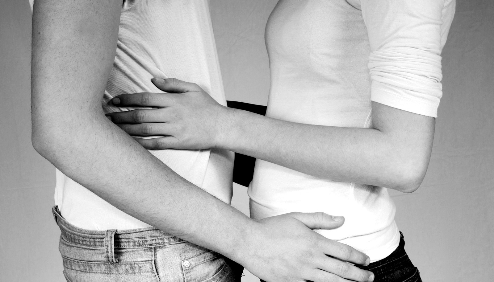 teen couple embrace awkwardly