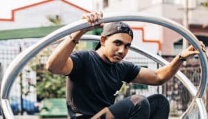 teen guy on playground equipment