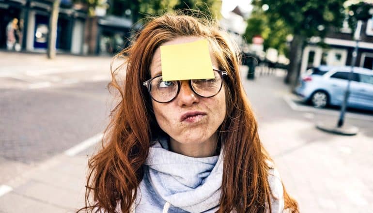 woman with post-it note on head