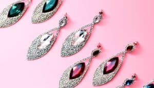 gemstone earrings on pink