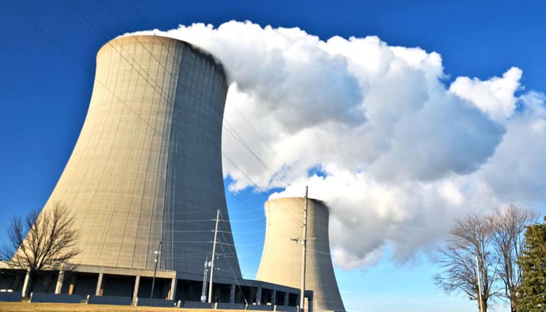looming nuclear power plant cooling tower