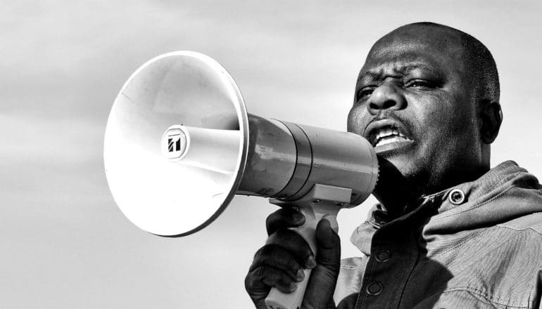 man with megaphone (climate change concept)