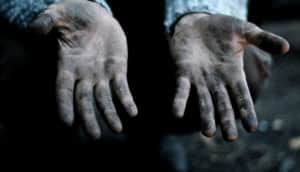 outstretched, muddy hands