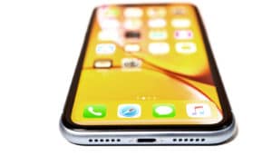 iphone XR with yellow homescreen on white