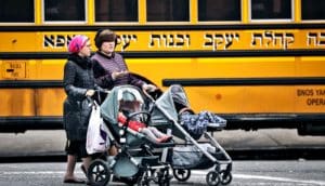women pushing strollers in brooklyn (measles vaccine concept)