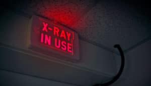 x-ray in use sign (proton therapy concept)