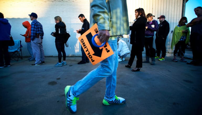 urban voters in line at polling place