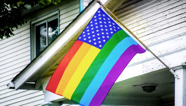 american/pride flag on house
