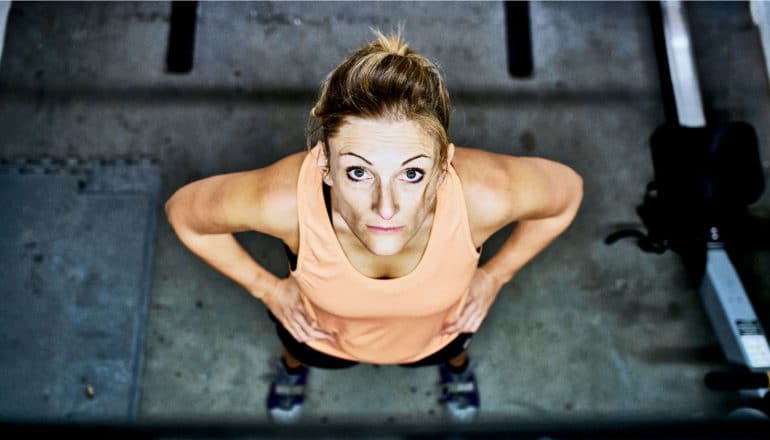 woman looking up at gym