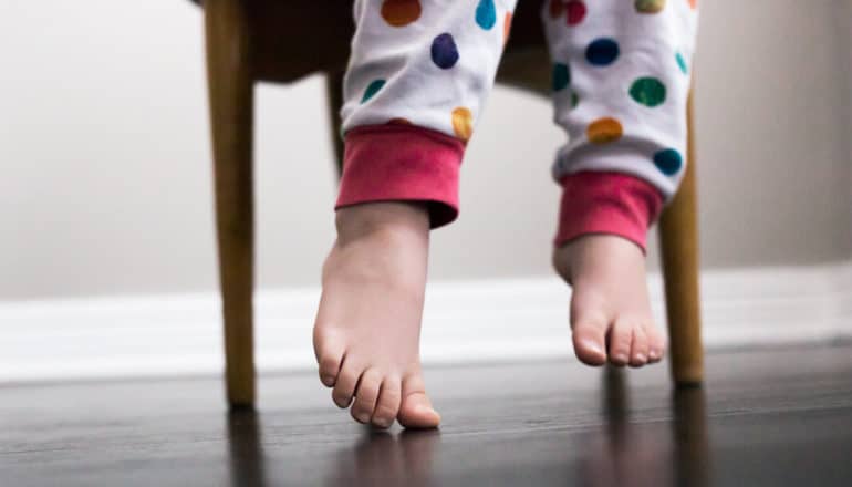 feet of child in polka dot pajamas