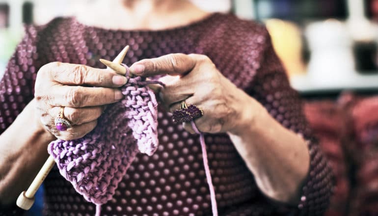 hands of elderly person knitting