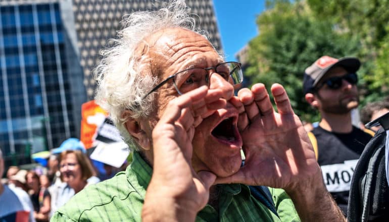 man yelling at protest (debates concept)