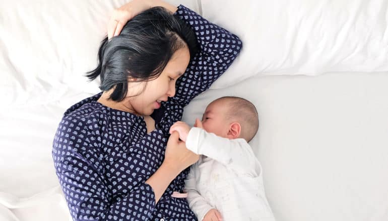 mom and baby in bed