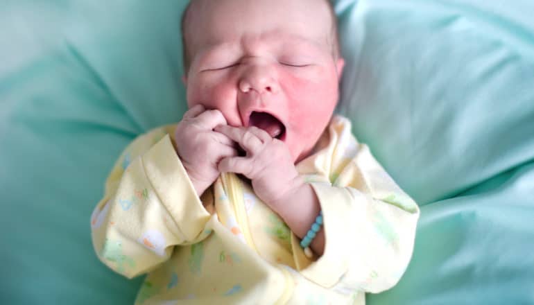 newborn baby mouths hands