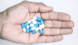 pills in palm of hand