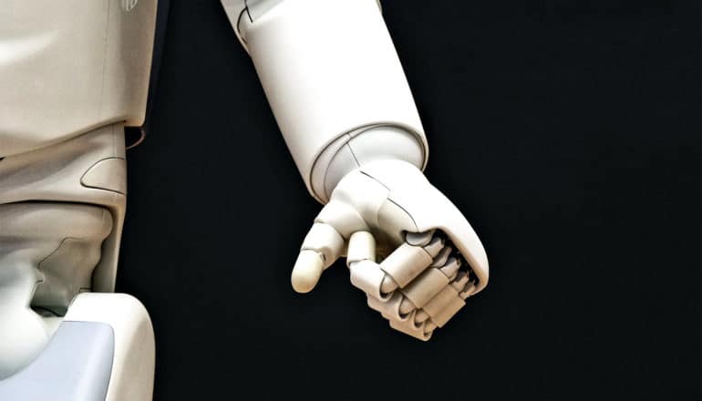 robot hand on dark background