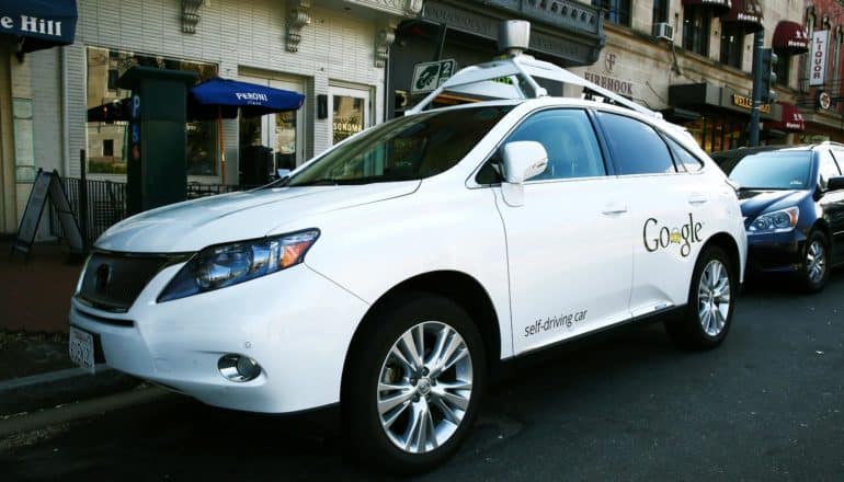 google self-driving car parked on street