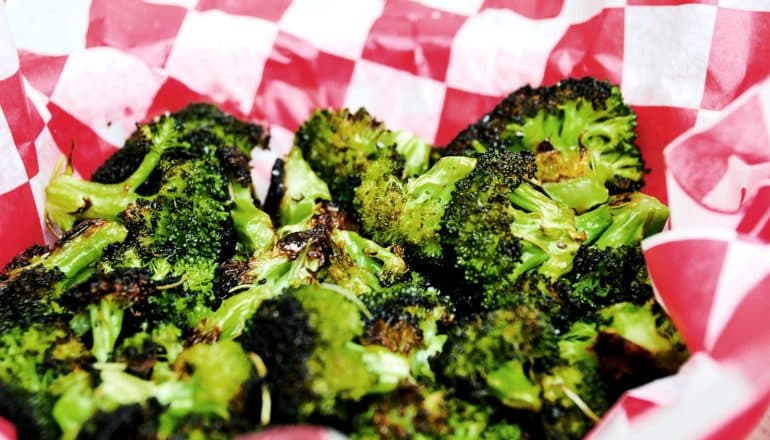 broccoli in paper serving container (bitter foods concept)