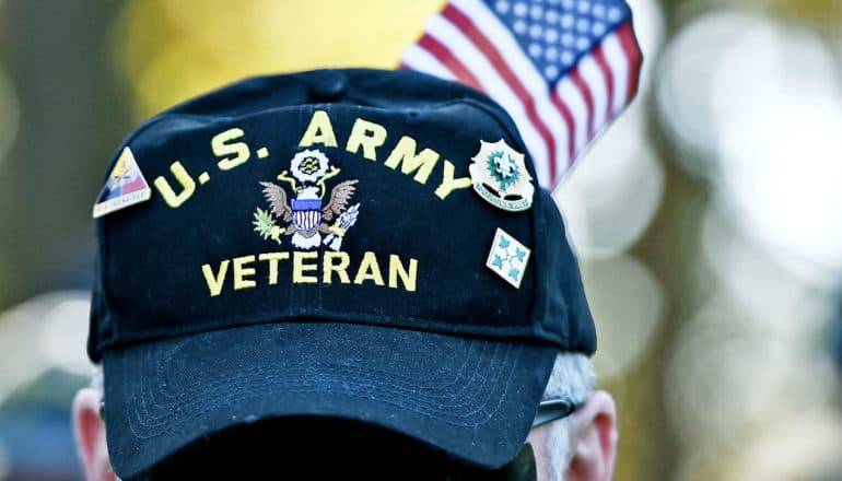baseball cap with pins says US Army Veteran - gulf war illness