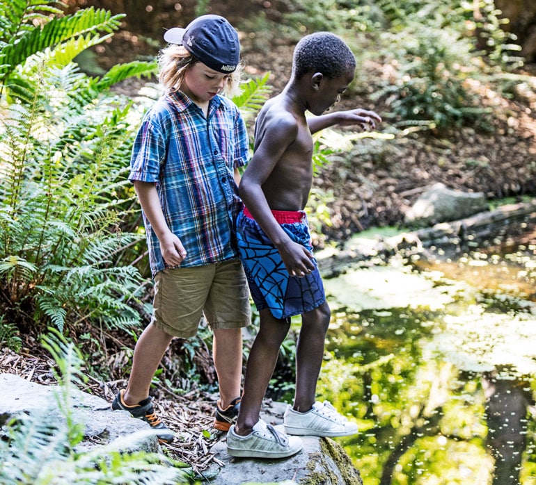 Two children explore the grounds within Washington Park Arboretum