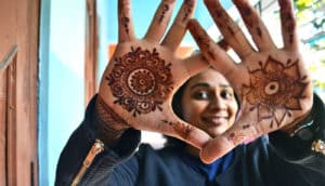 mehndi body art on hands (proteins concept)