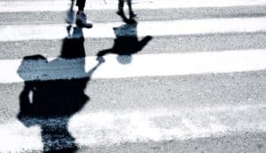 parent and kid in crosswalk (special education concept)