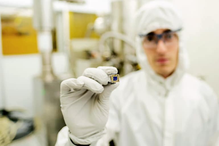 Aaron Sharpe holds a finished twisted bilayer graphene device - orbital ferromagnetism