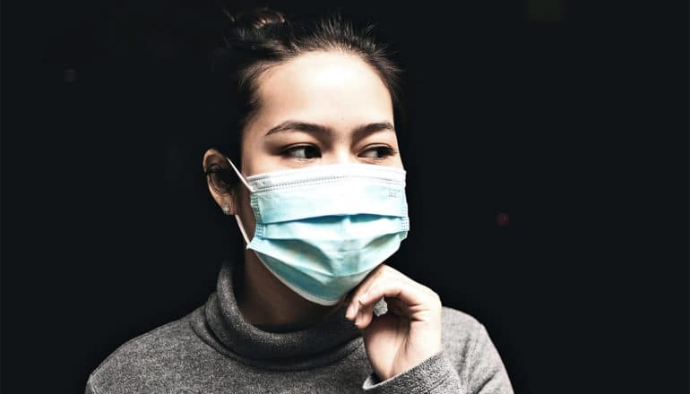 woman wearing medical mask (epidemic concept)