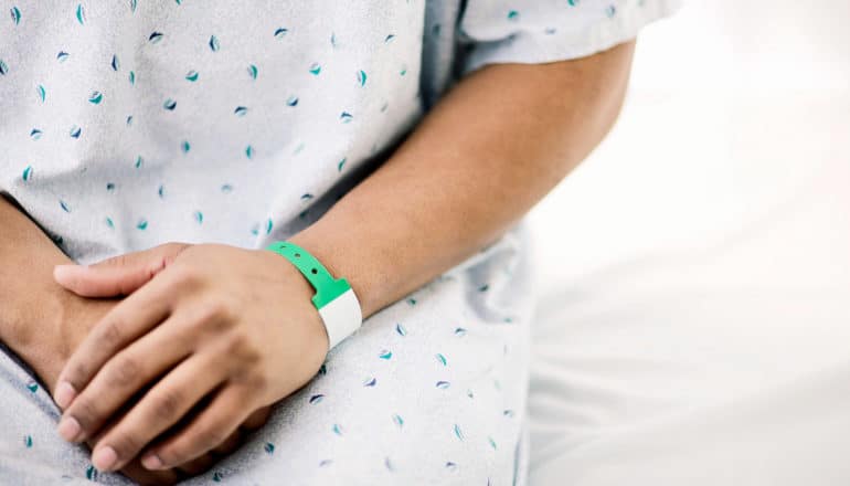 hands of hospital patient waiting for endoscopy procedure