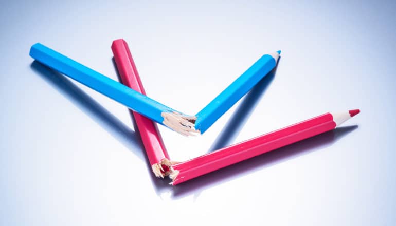 pink and blue pencils snapped in half