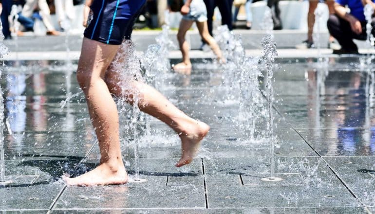 kids in fountain (urban heat island effect concept)