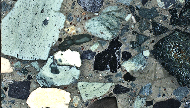 A cross-section shows rocks of various colors